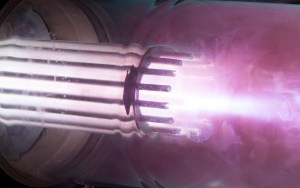 A long-exposure photographic image capturing the Stanford Plasma Gun during a single firing. The image shows where the plasma is brightest during the acceleration process, which occurs over tens of microseconds.