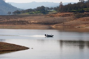 A fishing boat motors across Lake Nacimiento in San Luis Obispo County on Tuesday, January 26, 2016.  The recent rains have raised the water level to 22% of capacity.  (Vern Fisher - Monterey Herald)
