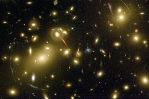 A Hubble Space Telescope image of galaxy cluster Abell 2218 showing "strong" gravitational lensing. (Credit: NASA, A. Fruchter and the ERO Team) 
